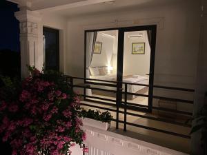 a balcony with a view of a bedroom at Tam Coc Elegance House in Ninh Binh