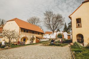 a cobblestone street in a village with a building at Boutique Apartmán Speicher in Prague