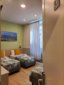 Posteľ alebo postele v izbe v ubytovaní Hotel Camilla Guelfa + 37 fotografií