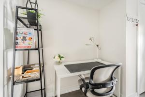 a desk with a chair next to a shelf at Traveller home in centre Toronto in Toronto