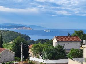 a view of the ocean and a boat in the water at Sunset Pool Retreat in Zagrađe