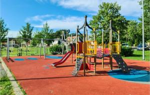 a park with a playground with a slide at Lovely Home In Lvestad With House A Panoramic View in Lövestad