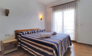 Postel nebo postele na pokoji v ubytování Apartaments Les Dunes