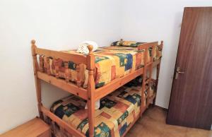 Postel nebo postele na pokoji v ubytování Apartaments Les Dunes