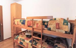 Postel nebo postele na pokoji v ubytování Apartaments Les Dunes