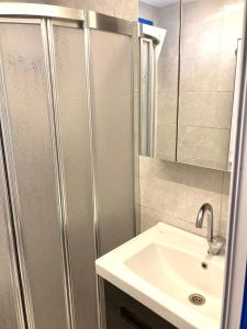 a bathroom with a shower and a sink at VİLLA DALAMAN in Dalaman