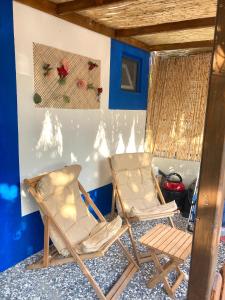 two chairs sitting in a room with blue walls at VİLLA DALAMAN in Dalaman