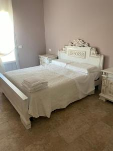 Postel nebo postele na pokoji v ubytování Agriturismo Tenuta Filippi