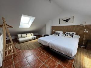 Ένα ή περισσότερα κρεβάτια σε δωμάτιο στο La Coteruca Beach