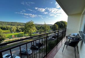 a balcony with a view of a parking lot at Apartament Sanna in Przemyśl