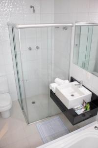 a bathroom with a shower and a sink and a toilet at Polar Rio Hotel in Sao Paulo