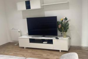 a white entertainment center with a flat screen tv at Amplio apartamento en Crevillente in Crevillente +8 photos