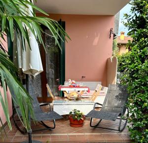 a patio with two chairs and a table on a patio at B&B Garda 4U in Desenzano del Garda