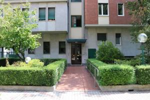 a building with a walkway in front of a building at Frattini Comfy family Home - 4 People in Milan