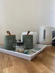 a tray with two coffee cups and a toaster at Appartement Centre Ville in Nevers