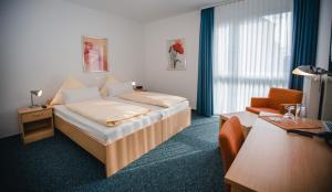 Postel nebo postele na pokoji v ubytování Johanniter Gästehaus + 37 fotografií