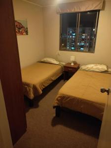 Ein Bett oder Betten in einem Zimmer der Unterkunft Bello Depa frente a Huaca!