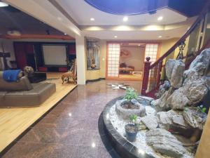 a large living room with a large rock wall at Van Nest near YVR UBC Downtown in Vancouver