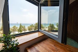 a room with a window with a view of the ocean at El Mirador in Alicante
