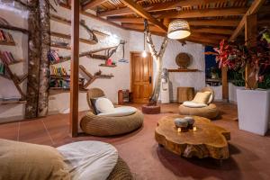 a living room with couches and a coffee table at Blu Galapagos Sustainable Waterfront Lodge in Puerto Ayora