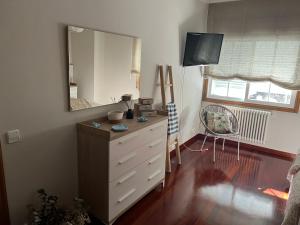 Televízia a/alebo spoločenská miestnosť v ubytovaní Apartamento mirador de tambo