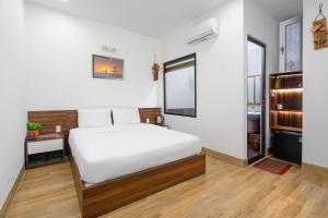 Posteľ alebo postele v izbe v ubytovaní Nguyên Hương Hotel