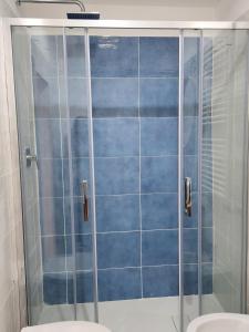 a bathroom with a shower and a toilet at MARÈ Terracina Apartments in Terracina