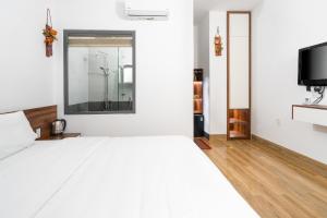 TV a/nebo společenská místnost v ubytování Nguyên Hương Hotel