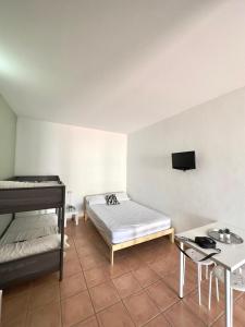 Posteľ alebo postele v izbe v ubytovaní #13 Mini ESTUDIO FAMILIAR AYAMONTE