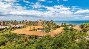 an aerial view of a resort with the ocean at Newly Renovated Studio on First Floor in Quiet Complex Across the Street from the Beach in Kihei