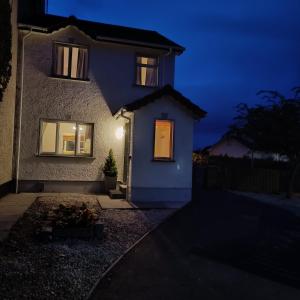 a house at night with the lights on at Bluebell House in Newry