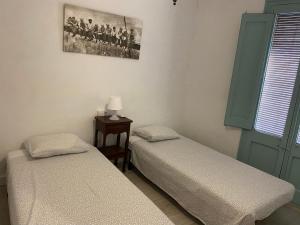 Posteľ alebo postele v izbe v ubytovaní Cal Mestre- Olot