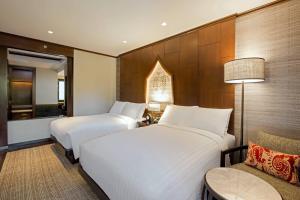 Ein Bett oder Betten in einem Zimmer der Unterkunft Phuket Marriott Resort and Spa, Nai Yang Beach