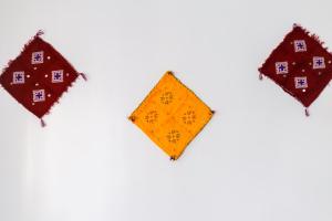 a group of three kites on a white background at The Rina Hostel in Agadir