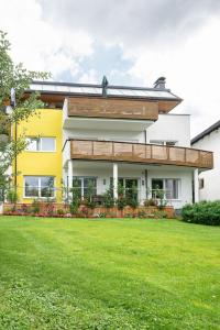 a house with a lawn in front of it at Appartement Christine in Eben im Pongau