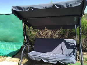 a camping tent with a chair under it at Numancia 12 in Santa María de la Alameda