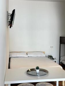 Una cama o camas en una habitación de #14 Mini ESTUDIO FAMILIAR AYAMONTE