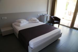 Postel nebo postele na pokoji v ubytování Enigma Resort