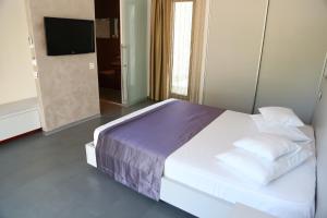 Postel nebo postele na pokoji v ubytování Enigma Resort