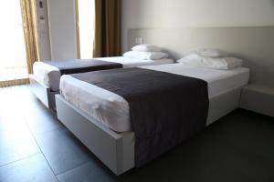 Postel nebo postele na pokoji v ubytování Enigma Resort