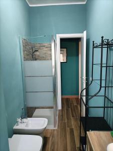a bathroom with a shower and a toilet and a sink at Colombo Holidays APT in Rome