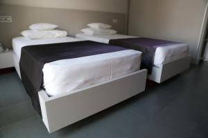 Postel nebo postele na pokoji v ubytování Enigma Resort