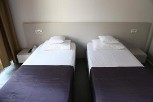 Postel nebo postele na pokoji v ubytování Enigma Resort