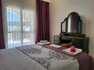 Кровать или кровати в номере Luxuriant Houses Kyrenia