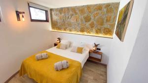 Postel nebo postele na pokoji v ubytování Bungalow Allende Famara con piscina privada y AC