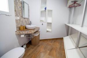 a bathroom with a toilet and a sink at RentitSpain Carrera del Mar, 17 Apartamento in Motril