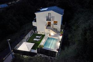 an aerial view of a house with a swimming pool at Vila Djordjevic in Herceg-Novi