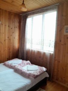 Postel nebo postele na pokoji v ubytování Guest House Guliada