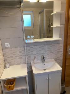 a bathroom with a sink and a mirror at Apartment Klara in Krk +37 photos