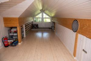 a large room with a ceiling with a window at Arctic Panorama House in Lødingen +33 photos